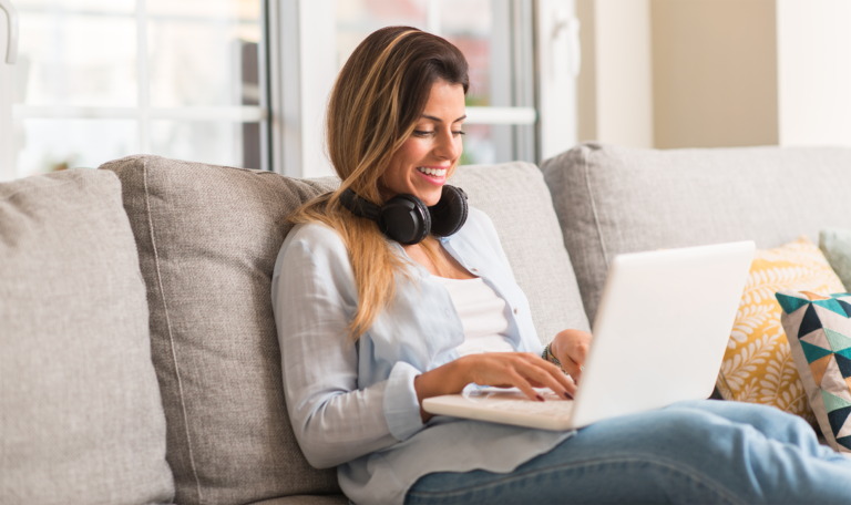 woman working remotely from home on a laptop